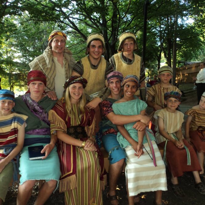Group in colorful biblical costumes outdoors