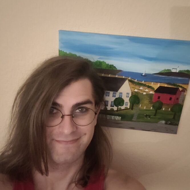 Smiling person with glasses in front of painting