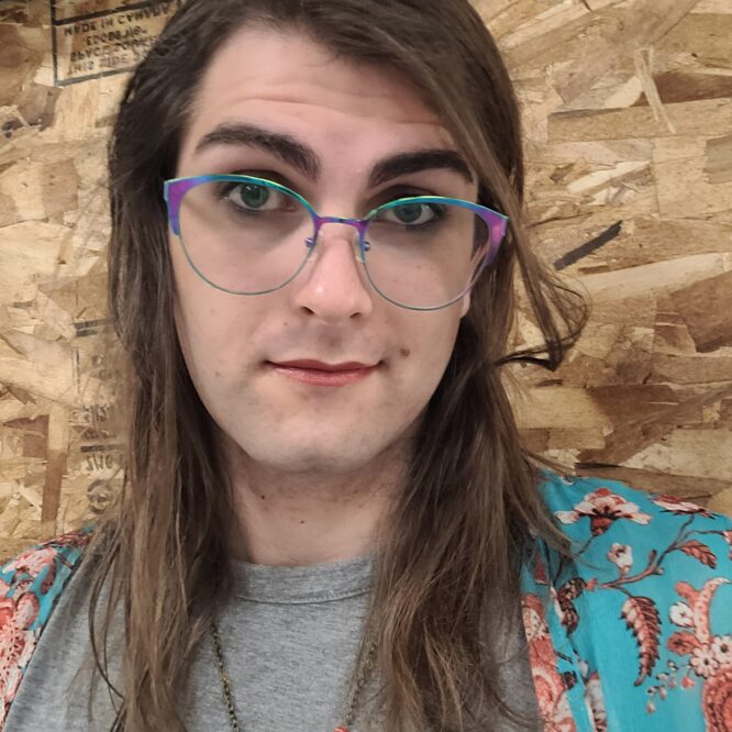Person with colorful glasses and long hair